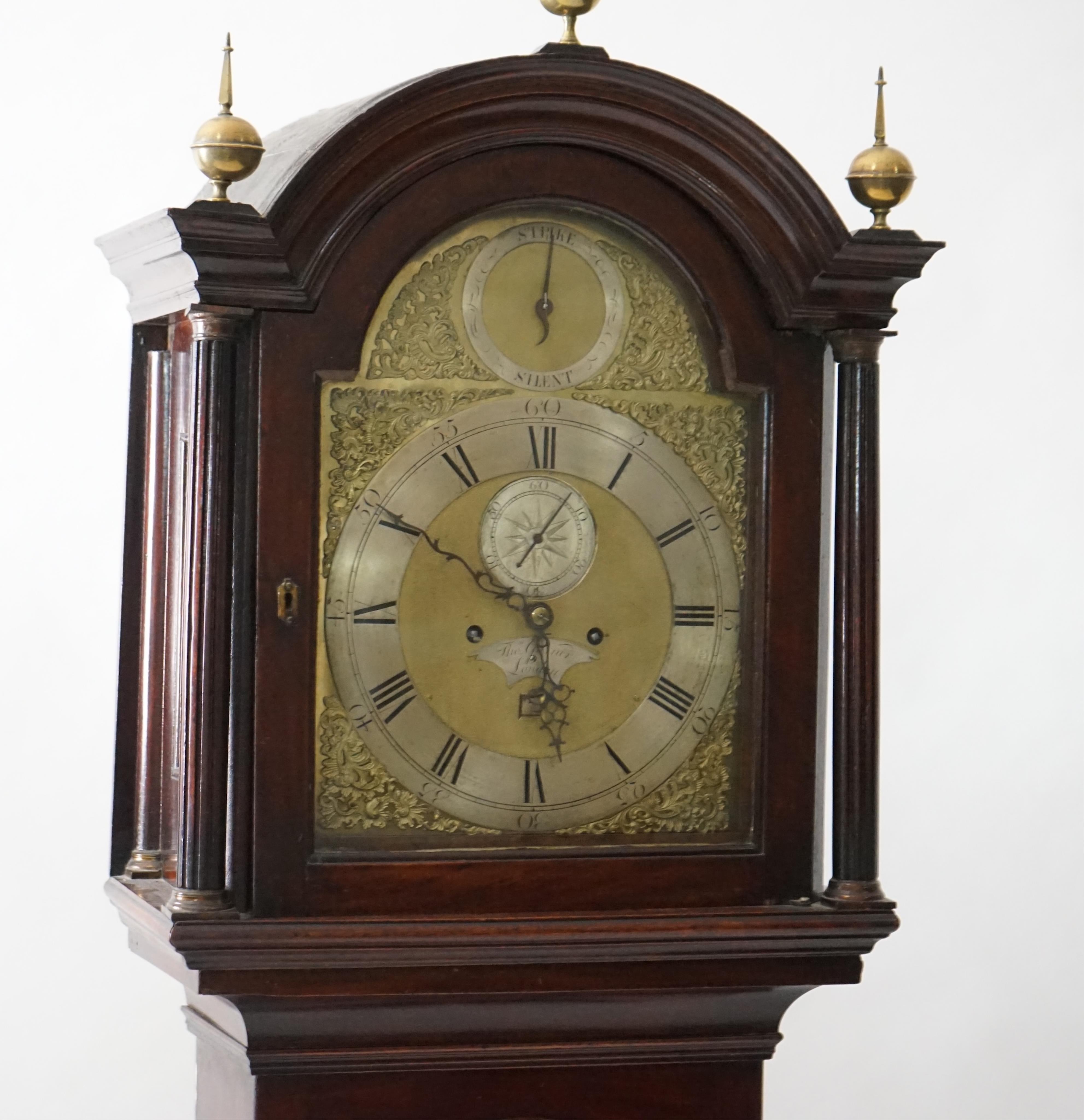 Thomas Garner of London, a George III mahogany eight day longcase clock, the arched brass dial with silvered strike / silent, Roman chapter ring, subsidiary seconds and date aperture, five pillar movement with anchor esc